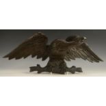 A 19th century oak cresting, boldly carved as an eagle, 55.5cm wide, c.