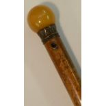 A 19th century gentleman's malacca walking cane, globular butterscotch pommel, gilt acanthus ferule,