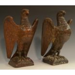 A pair of 19th century oak country house newel post crestings, each well carved as a falcon,