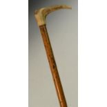 A 19th century angler's novelty system walking stick, the cane enclosing a 'poacher's' fishing rod,