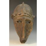Tribal Art - a Bambara Ntomo society mask, domed 'half-helmet' with central ridge,