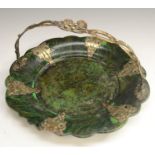 A Victorian gilt-metal mounted 'malachite' papier-mâché shaped circular basket,