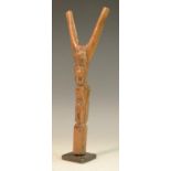 Tribal Art - a Baule catapult, carved with stylised masks, 22.