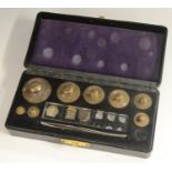 A set of scientific scale weights, for weighing fractions, bakelite case, 15.