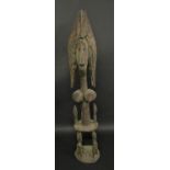 Tribal Art - a Bamana janus figure, stylised headress adorned with copper rings, bust length,