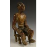 Tribal Art - a Guro figure, seated upon a stool, 25cm high,