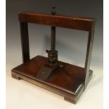 A George III mahogany book press, turned thread and handle, rectangular base, 33cm wide, c.