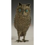A Tibetan silver model of an owl, applied with turquoise and coral cabochons, 6.