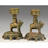 A pair of Indian bronze lamps/rosewater droppers, each cast as a cow,