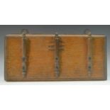 An Edwardian oak wall hanging whip rack, stamped Callow & Son, Whip Makers, Park Lane, 33cm wide, c.