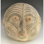 Tribal Art - an African mask, of domed circular outline,