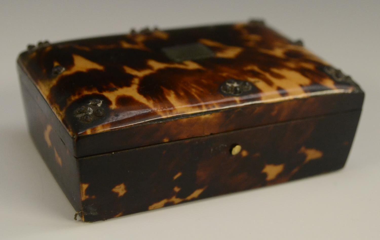 A 19th century tortoiseshell casket, hinged cover decorated with cut steel pinwork, 8.5cm wide, c.