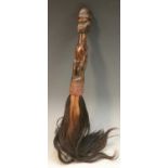 Tribal Art - an African flywhisk, janus figural handle, scarified features,