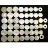 A collection of Chinese mother-of-pearl circular gaming counters, variously engraved, Canton,