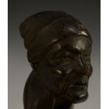 A Black Forest lever-action novelty nut cracker, carved as the head of a lady in a headscarf,