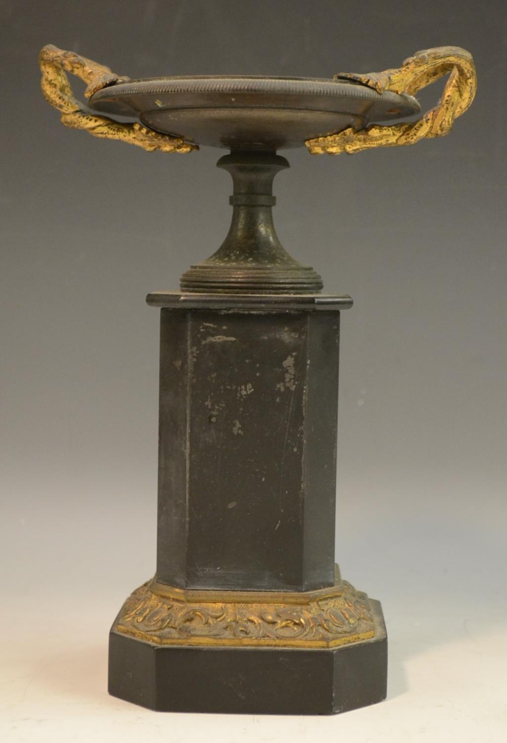 A 19th century parcel-gilt and brown patinated bronze saucer-shaped mantel urn,