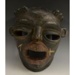 Tribal Art - a Yoruba Odun Egungun mask, of half-helmet form,