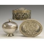 A 19th century silver coloured metal circular box and cover, possibly Turkish,