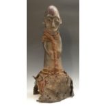 Tribal Art - an African figure, of phallic form and clad with cord and fabric,