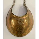 A George III/IV Universal Pattern brass gorget, engraved with crowned GR cypher flanked by laurel,