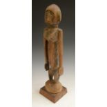 Tribal Art - a Dogon figure, standing, with elongated arms at the sides, 43.