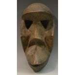 Tribal Art - a Dan bird mask, of simple, of highly stylised 'Cubist' conception, 24cm long,