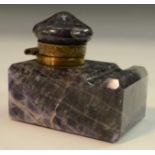 An early 20th century amethyst quartz desk inkwell, hinged cover,