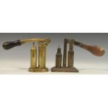 Shooting - a 19th century brass cartridge loader, turned ebonised handle,