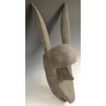 Tribal Art - a Bamana N'tomo mask, anthropomorphic features and elongated ears, 56cm long, Mali,