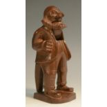 A Black Forest table top lever-action novelty nut cracker, carved as a bearded man,