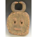 Tribal Art - a Baule Kple-Kple mask, of typical flat and rounded form,