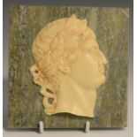 A Grand Tour type plaque, applied withba profile portrait head of a Roman, on a marble ground, 13.