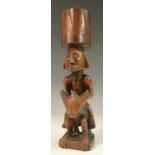 Tribal Art - an African 'equestrian' figure, the oversized rider upon a highly stylised beast,