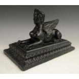 A 19th century black pressed glass model, by John Derbyshire, of the Theban Sphinx,