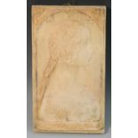 A Continental terracotta rectangular plaque, in relief with a profile portrait,