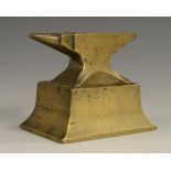 A brass jeweller's bench anvil, integral spreading rectangular base,