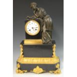 A 19th century French dark patinated bronze, ormolu and black marble mantel clock,