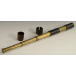 A 19th century leather-bound brass three-draw pocket telescope, aperture cover to eyepiece,