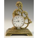 A 19th century brass pocket watch stand, as a griffin monopod, rectangular base with bracket feet,