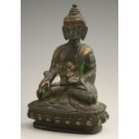 Chinese School, a dark patinated bronze, of Buddha, seated in meditation, 10.