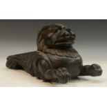 A 19th century Anglo-Indian hardwood sculptural furniture fest, boldly carved as a stylised lion,