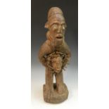 Tribal Art - a Kongo nkisi n'Kondi fetish figure, he stands, the belly adorned with 'mambu' nails,