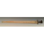An Indian tulwar, 74cm straight fullered blade, steel hilt with disc pommel, scabbard ensuite,