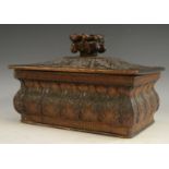 A Black Forest box and cover, fruiting branch finial, carved overall with stiff leaves and acanthus,