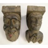 A post-Medieval oak corbel grotesque, carved as a bearded man, his tongue protruding,