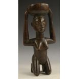Tribal Art - an African figure, possibly Kuba, Democratic Republic of Congo, she kneels,