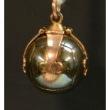 A 9ct yellow and white gold Masonic orb pendant, of typical folding-cross form, marked to the loop,