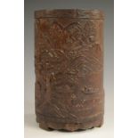 A Chinese bamboo bitong brush pot, carved in relief with fishermen in sampans,