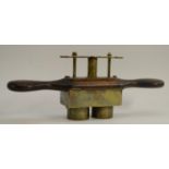 Kitchenalia - a Victorian elm and brass two-section biscuit press, spring-loaded mechanism,