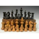 A boxwood and ebonised Staunton pattern chess set, the Kings 7.